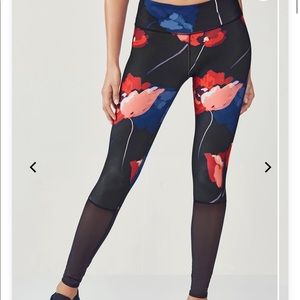 Fabletics Black Leggings with Blue and Red design.